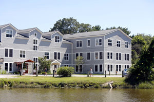 photo of a building next to a river